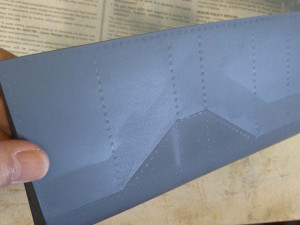 Rivets painted on with primer.